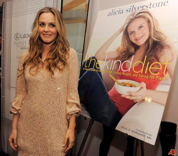 Alicia Sillverstone w/ poster for her book "The Kind Diet;" Associated Press image via newshopper.sulekha.com